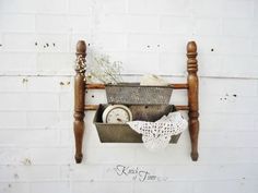 an old wooden chair with some items in it