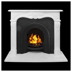 a white fireplace with fire in it