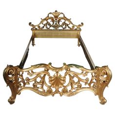 an ornate gold metal bed frame