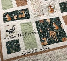 a quilted wall hanging with animals on it and the words aritry witf fabric