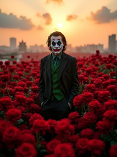 a man in a suit and mask standing in a field of red flowers with the sun setting behind him