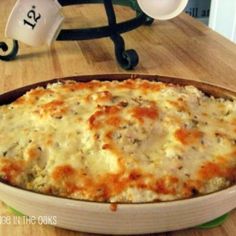 a casserole dish sitting on top of a wooden table