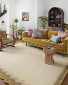 a living room filled with furniture and decor