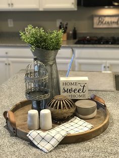 a kitchen counter top with various items on it and a sign that says home sweet home