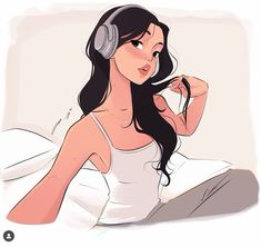 a woman with headphones sitting on a bed