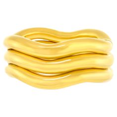 Circa 1970s, 18k, by Tiffany & Co. The bold visual narrative of this bracelet is glamorously American and wildly seventies. In a single brushstroke, the decoration and form are one. Instantly timeless and brilliantly chic, this oversize bangle can be worn every day. Meticulously fabricated, it is in excellent condition. Remark: "Tiffany is renowned for their yellow gold élan." Second Remark; "Sometimes bigger isn't just better - it's spectacularly better!" SIZE: Fits average wrist WEIGHT: 152.4 Visual Narrative, Slim Aarons, Tiffany And Co, Gold Bangle, Gold Bangles, Tiffany & Co., Brush Strokes, Cuff Bracelets, Jewelry Bracelets