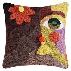 a decorative pillow with an eye on it