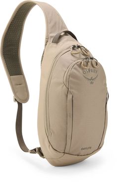 a beige sling backpack with an adjustable strap