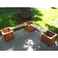 a wooden bench sitting on top of a cement ground