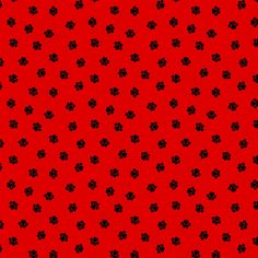 a red background with black flowers on it