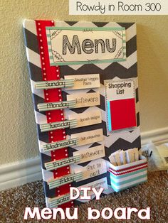 a menu board made out of scrapbook paper and some other items on the floor