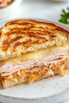 a grilled cheese and ham sandwich on a plate