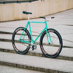 a blue bicycle parked on some steps