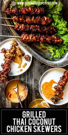 grilled thai coconut chicken skewers on a platter with dipping sauces