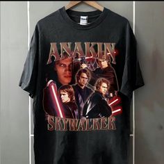 a black shirt with an image of the characters from star wars and anakin on it