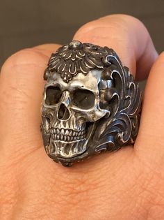 Ring Profile: 🔱 This is the heavy metal rock star of our skull rings. The hyper realistic skull is individually cast in 925 silver and embedded in an intricate floral ornament silver ring band to give the ring a contrasting dual-tone of silver. This eye-catcher skull ring is an absolute conversation-starter piece of work. 🔱 Customizable gemstone eye embellishment, please Contact Us for personal customization. 🔱 Available ring band finishes: | Polished | Dark Antique | Burnt Charcoal | 🔱 The Floral Armor, Realistic Skull, Skull Reference, Silver Ring Band, Skull Rings, Exotic Jewelry, Silver Skull Ring, Apocalyptic Fashion, Rustic Rings