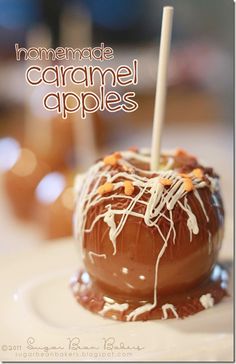 a chocolate covered dessert sitting on top of a white plate with a toothpick sticking out of it