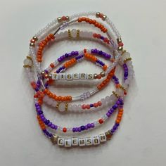 Set Of Five Handcrafted Beaded Bracelets Celebrating College Spirit! Each Bracelet Showcases Vibrant School Colors And Is Personalized With Your College's Name. Perfect Accessory To Flaunt Your School Pride Or A Thoughtful Gift. Embrace Your College Journey With These Stylish And Meaningful Bracelets! Clemson Bracelet, Cider Stand, Back To School Bracelets, Meaningful Bracelets, Bracelet Stacks, Clemson University, School Pride, Craft Corner, Homemade Jewelry