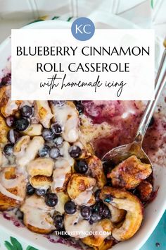 blueberry cinnamon roll casserole with homemade icing in a white serving dish