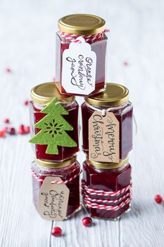 three jars filled with jam sitting on top of each other