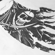 a drawing of a pirate skull and crossbones on a sheet of white paper