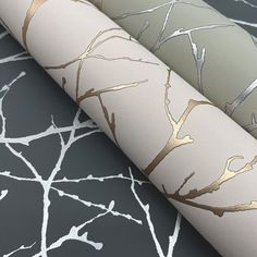 three different wallpapers with gold and silver tree designs on the side of them