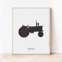 a black and red tractor on a white background with the words winkkler written below it