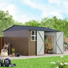 a garden shed with the door open and lawn mower nearby