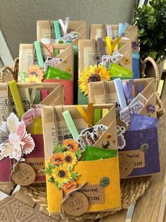 a basket filled with lots of different types of cards and tags on top of a wooden table