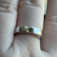 This elegant 90s solitaire ring features one oval shape natural green peridot set in a simple 10K white gold setting.  ---Details--- Metal: 10K White Gold Stone: Natural Peridot Size: 5x3mm approx. Total ct weight: 0.25ct approx. Era: Original Vintage Condition: Excellent Stamp: 10K Weight: 3.6grams  The ring comes in a gift-ready box. Ring Bezel, Peridot Ring, Peridot Gemstone, Green Peridot, Gold Stone, Solitaire Ring, Gemstone Ring, Estate Jewelry, Band Ring