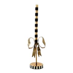 a black and white striped pole with two bows on it's top is shown