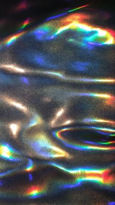 an abstract image of water with rainbow colors