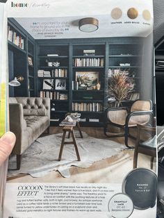 a living room filled with furniture and bookshelves