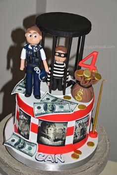 a cake decorated with money and police figures