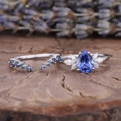 Unique Pear Shaped Blue Sapphire Engagement Ring Set Antique | Etsy Pear Shaped Engagement Rings Sapphire, Pear Cut Sapphire Engagement Ring, Pear Shaped Sapphire Ring, Blue Round Wedding Ring, Sapphire Marquise Diamond Ring, Blue Wedding Rings Sapphire, Blue Wedding Jewelry With Accent Stones, Silver Sapphire Engagement Ring, Blue Moissanite Engagement Ring