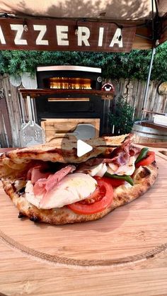 a pizza sitting on top of a wooden table