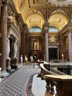 the inside of a building with many statues