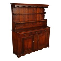 an old wooden dresser with drawers and cupboards on it's sides, isolated against a white background