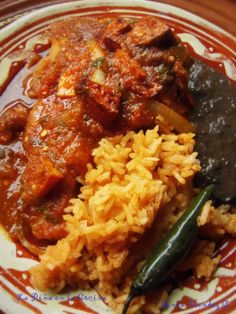 a plate with rice, beans and other food on it