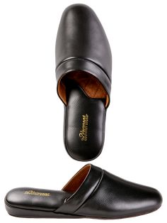 You won't give a second thought to your feet once you slip on our genuine all-leather scuffs. That's because they sport hand-turned leather uppers, which means all the seams are tucked invisibly inside for a classic look and ultra-comfortable fit. All that's missing is a velvet smoking jacket and ascot. We'll leave that up to you. Crafted in buttery soft leather No irritating seams Soft leather insoles Suede outsoles Width runs narrow Spot clean Imported Coordinating Genuine Leather Slippers (#31642), sold separately | Men's Genuine Leather Scuffs - Black - 10 - The Vermont Country Store Comfortable Black Slip-ons With Leather Sole, Classic Black Mules With Leather Sole, Classic Black Mules With Rubber Sole, Black Leather Slippers With Branded Insole, Classic Black Slippers With Rubber Sole, Classic Leather Slippers With Round Toe, Black Leather Slippers With Removable Insole, Classic Black Closed Toe Mules, Black Slip-ons With Leather Lining And Round Toe