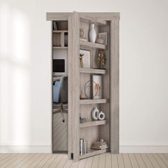 an open bookcase in the corner of a room with white walls and wooden floors