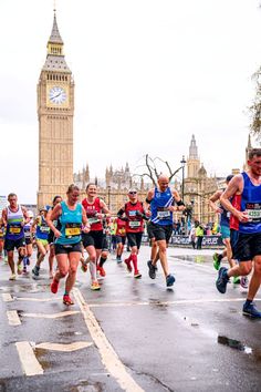 a group of people that are running in a race with big ben in the background