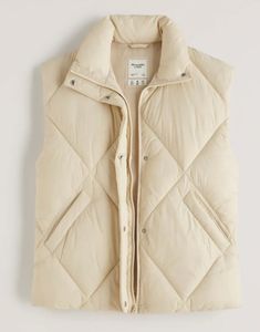 New Abercrombie "Oversized Fit" Quilted Puffer Vest  French Vanilla Size Large We have other sizes and colors in our store. There's nothing quite like the feeling of putting this vest on!  Our new puffer vest in a wind-and water-resistant fabric. Featuring quilting details, flattering wedge fit, extended shoulder detail, tall collar, zip and snap up front, cozy interior lining and pockets.  Imported. Retail is $99.00 On Sale Now $68.50 I would recommend true to size for an oversize fit, and sizi Fleece Vest Women, Feather Vest, Camo Vest, Faux Suede Vest, Puff Vest, Oversized Vest, Jean Jacket Vest, Fall Vest, Quilted Puffer Vest