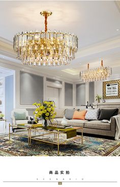 a living room filled with furniture and a chandelier hanging from the ceiling above it