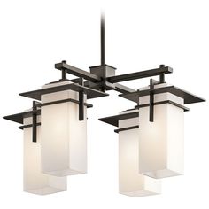 three light chandelier with white glass shades on the bottom and black metal frame