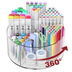 a clear container filled with lots of different colored pens and pencils next to each other