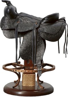 a close up of a horse saddle on a stand