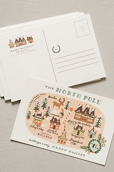 the north pole postcard is shown on top of two envelopes