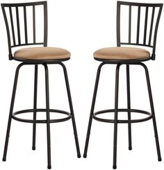 pair of black metal bar stools with tan upholstered back and seat cushions