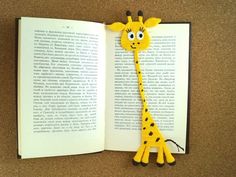 an open book with a giraffe cut out of it